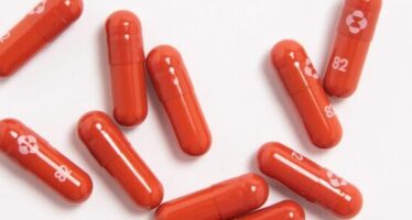 Merck’s Antiviral Pill Halves Risk of COVID Hospitalization